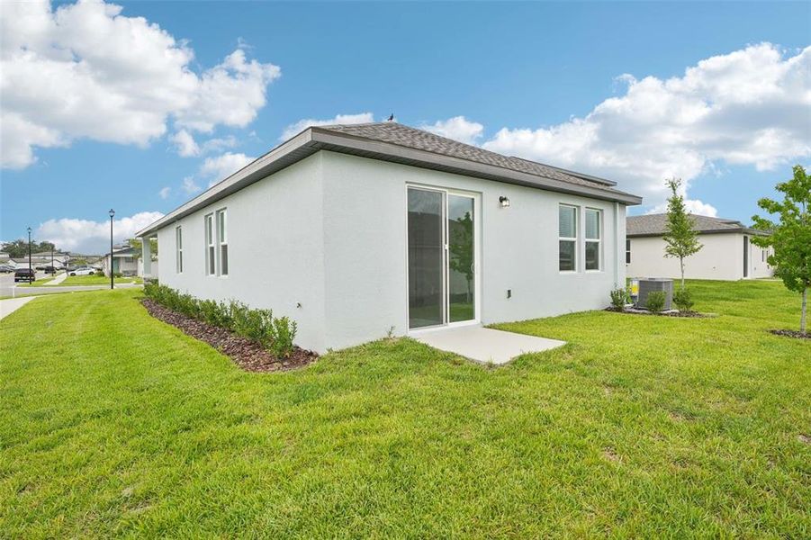 Front exterior of a new home in The Grove at Stuart Crossing - Premier Series, Bartow, FL, highlighting curb appeal (Image 15). Front exterior of a new home in The Grove at Stuart Crossing - Premier Series, Bartow, FL, highlighting curb appeal (Image 15).
