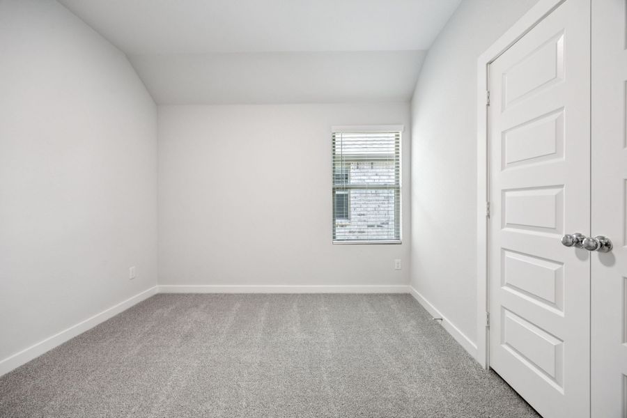 Bedroom in the Emmy II home plan by Trophy Signature Homes - REPRESENTATIVE PHOTO Bedroom in the Emmy II home plan by Trophy Signature Homes - REPRESENTATIVE PHOTO