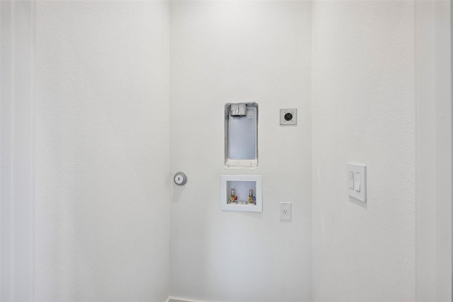 Ready-to-install laundry room with essential hookups for stackable washer/dryer.