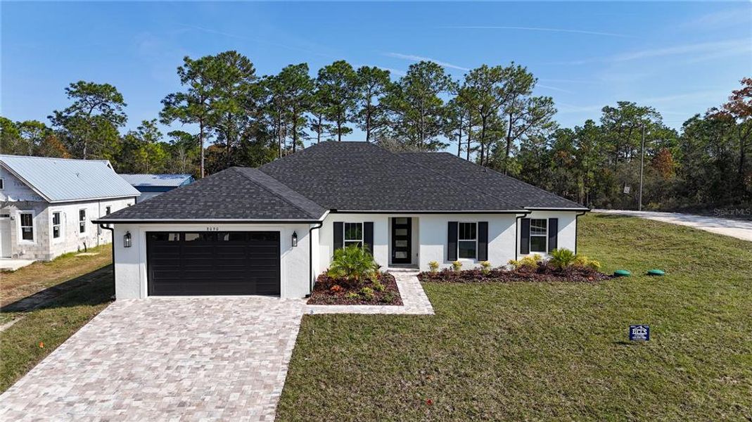 Front exterior of a new home in , Brooksville, FL, highlighting curb appeal (Image 2).