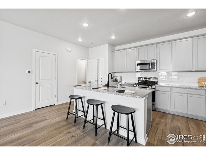 Furnished interior view inside a new home in Kinston Mainstreet Townhomes, Loveland (Image 4). Furnished interior view inside a new home in Kinston Mainstreet Townhomes, Loveland (Image 4).