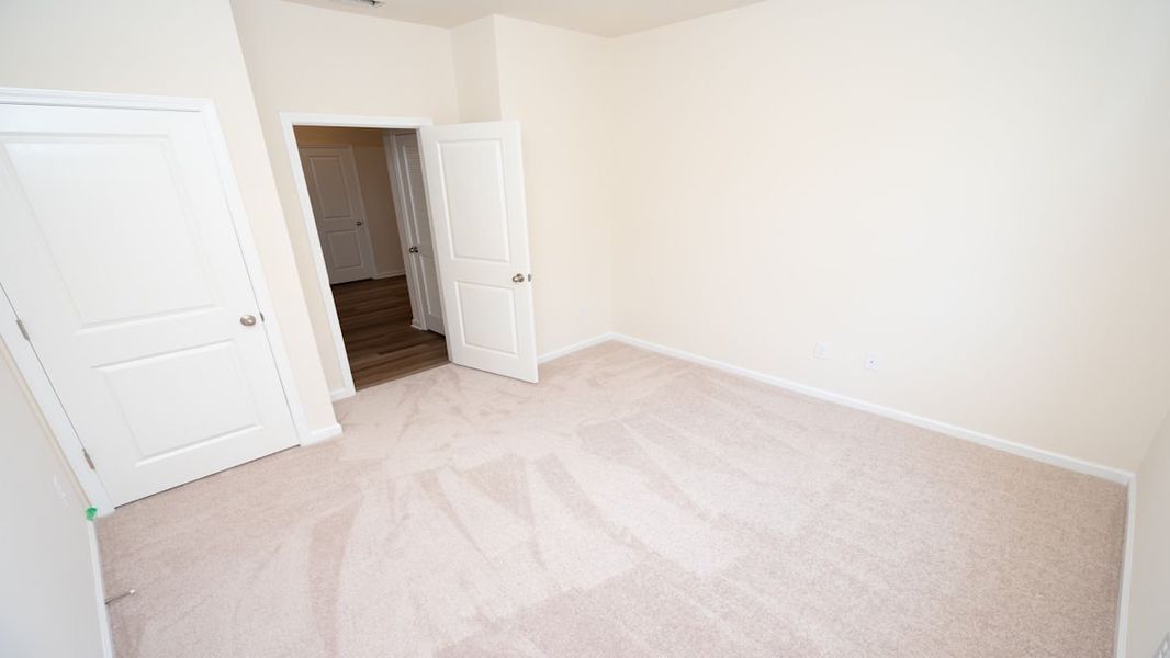 Representative unfurnished interior of a home built from the CALI by D.R. Horton in Lochaven, Conway (Image 24).