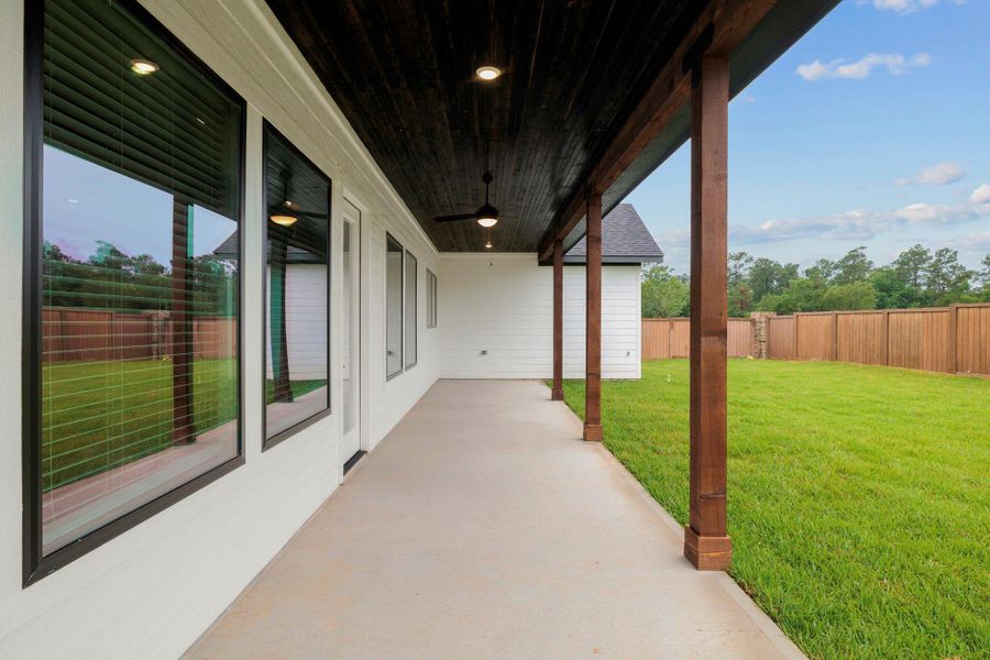 Exterior details and patio area of a home in Magnolia Woods - 70', Magnolia (Image 3).