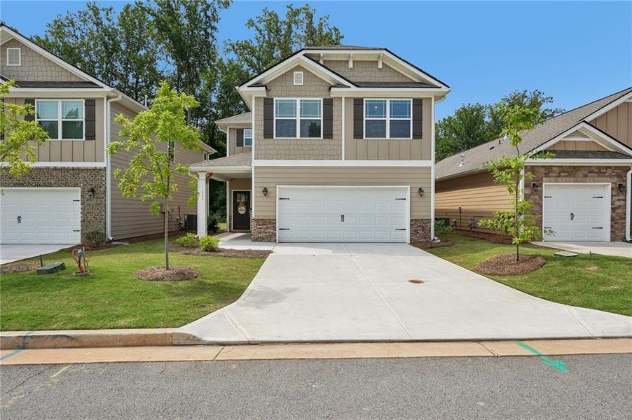 Front exterior of a new home in Windmill Park, Carrollton, GA, highlighting curb appeal (Image 1). Front exterior of a new home in Windmill Park, Carrollton, GA, highlighting curb appeal (Image 1).