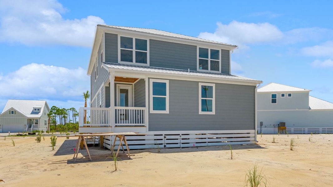 Front exterior of a new home in Redfish Cove at Cape San Blas, Port Saint Joe, FL, highlighting curb appeal (Image 25).