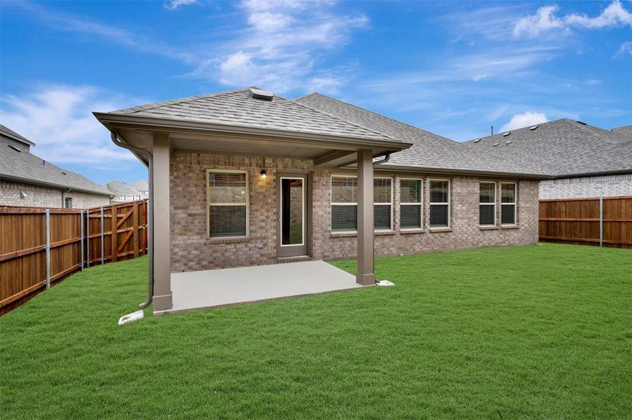 Exterior details and patio area of a home in Woodstone, Providence Village (Image 24).
