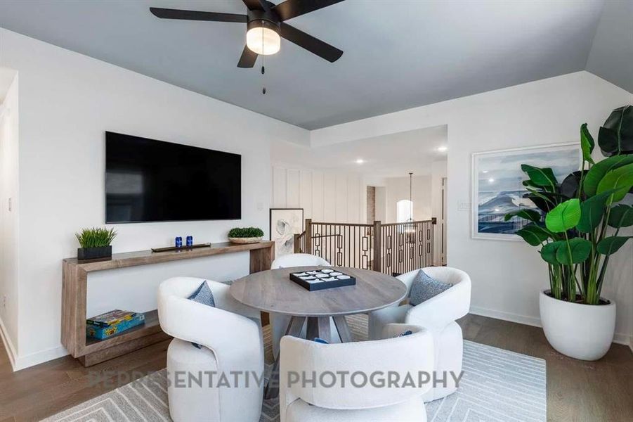 Dining area featuring dark wood finished floors and ceiling fan Dining area featuring dark wood finished floors and ceiling fan