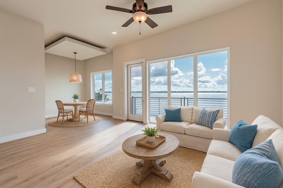 Virtually staged image of the living and dining.  Fantastic view