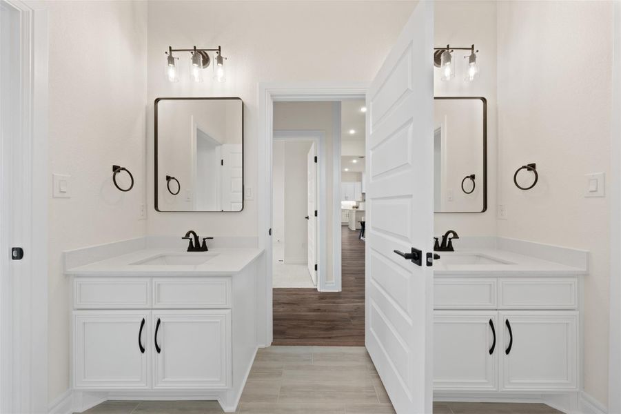 Bathroom with two vanities and light wood finished floors Bathroom with two vanities and light wood finished floors