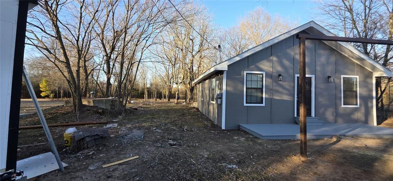 View of property exterior with board and batten siding