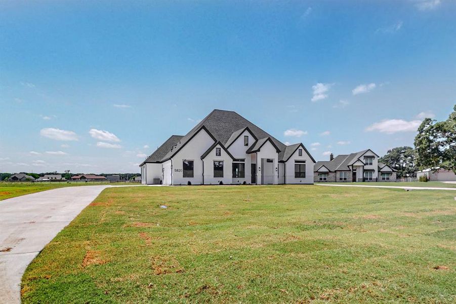 View of front of house with a front lawn