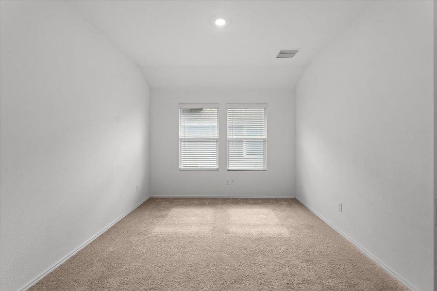 A well-lit room awaits your personal touch with soft carpet flooring and multiple windows. A well-lit room awaits your personal touch with soft carpet flooring and multiple windows.