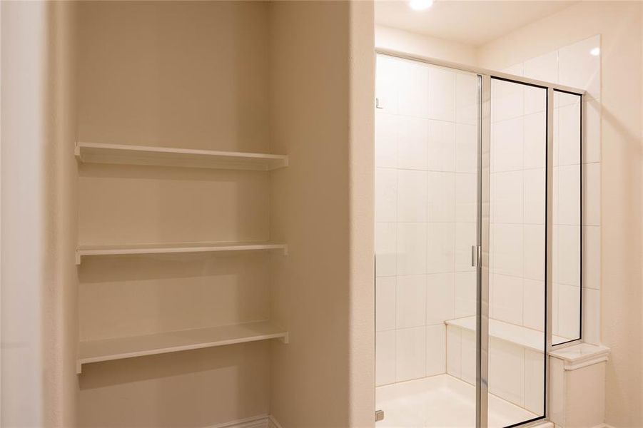 Bathroom featuring a stall shower Bathroom featuring a stall shower