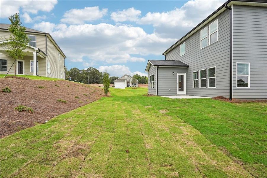 Exterior details and patio area of a home in Northwoods at Mirror Lake, Villa Rica (Image 32).