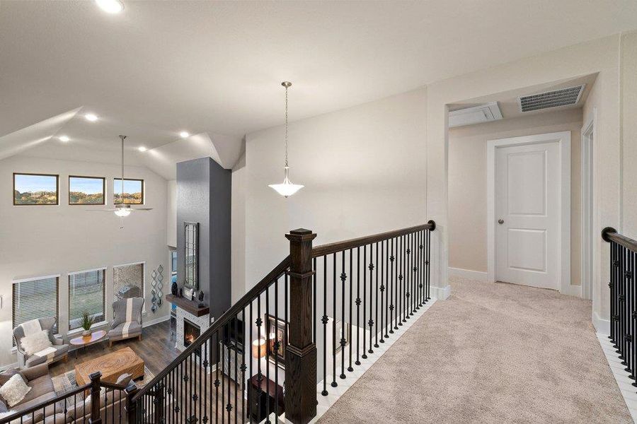 Open upstairs landing overlooking the main living area.