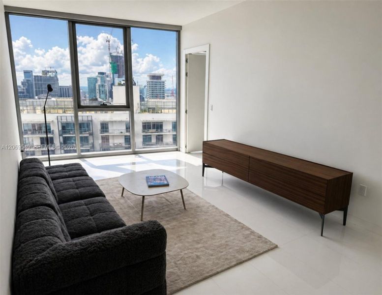 Den area turned into an informal living room/ TV room