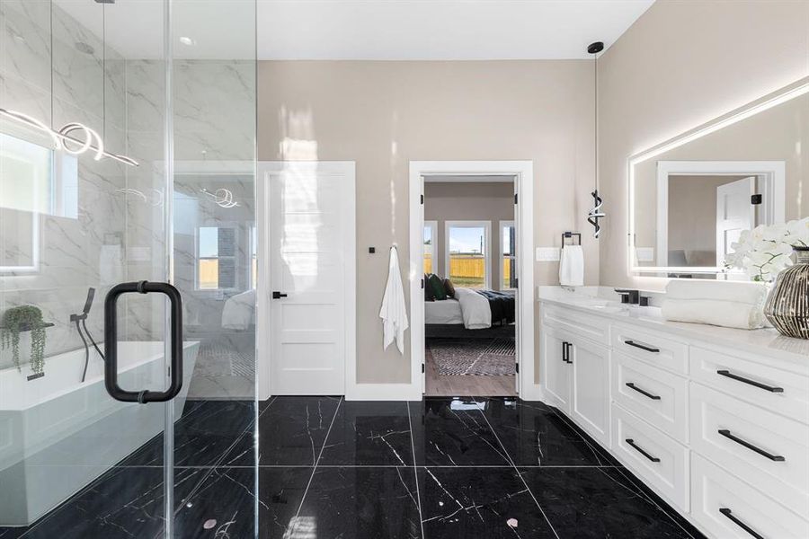 Bathroom featuring vanity and walk in shower