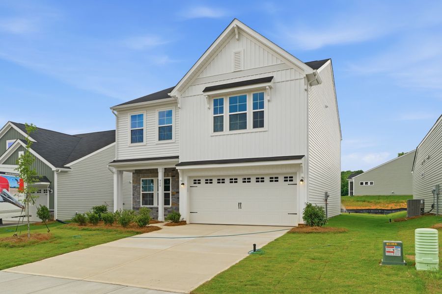Front exterior of a new home in Piper Creek, Newton, NC, highlighting curb appeal (Image 18). Front exterior of a new home in Piper Creek, Newton, NC, highlighting curb appeal (Image 18).