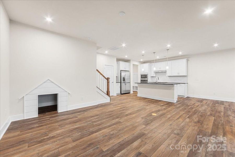 Great Room Featuring Built-In Pet House and Open Rail Detail.