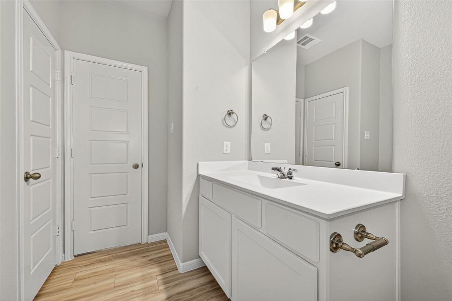 Furnished interior view inside a new home in Sunterra, Katy (Image 9).