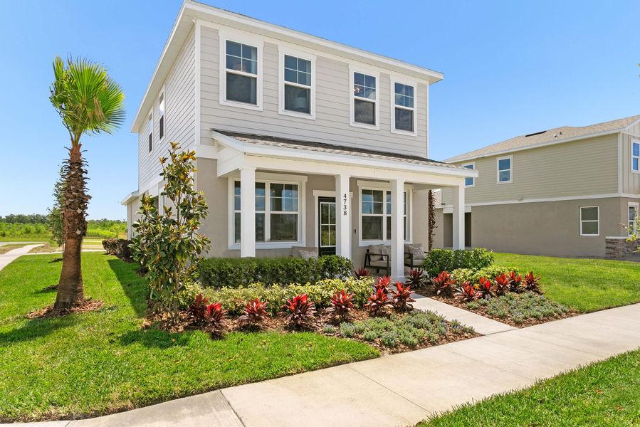 Front exterior of a new home in Brack Ranch, St. Cloud, FL, highlighting curb appeal (Image 26). Front exterior of a new home in Brack Ranch, St. Cloud, FL, highlighting curb appeal (Image 26).