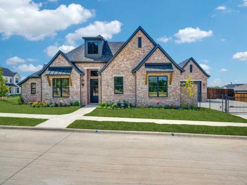 Front exterior of a new home in , Denton, TX, highlighting curb appeal (Image 2). Front exterior of a new home in , Denton, TX, highlighting curb appeal (Image 2).