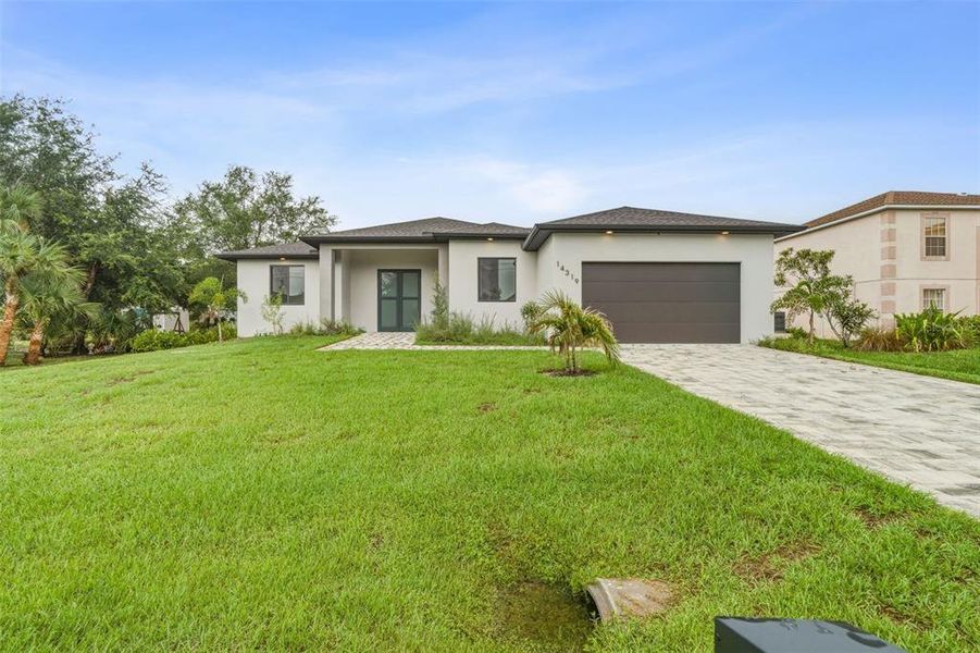 Front exterior of a new home in , Port Charlotte, FL, highlighting curb appeal (Image 27). Front exterior of a new home in , Port Charlotte, FL, highlighting curb appeal (Image 27).
