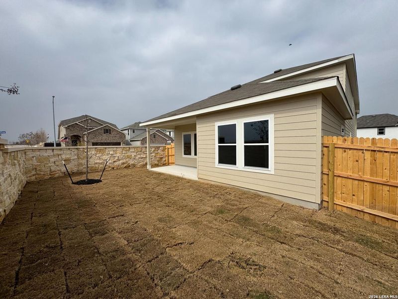 Exterior details and patio area of a home in Hennersby Hollow, San Antonio (Image 20).