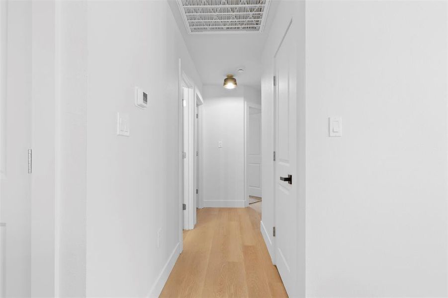 Hallway featuring light hardwood / wood-style flooring