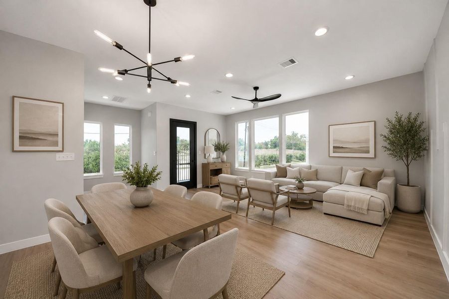 Bright open-concept living & dining space featuring modern finishes, abundant natural light, & warm contemporary design. Thoughtfully staged for comfortable everyday living & effortless entertaining.