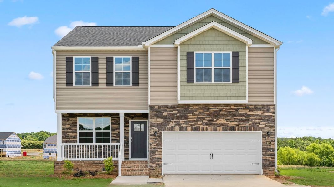 Front exterior of a new home in Aurora Acres, Snow Camp, NC, highlighting curb appeal (Image 1). Front exterior of a new home in Aurora Acres, Snow Camp, NC, highlighting curb appeal (Image 1).