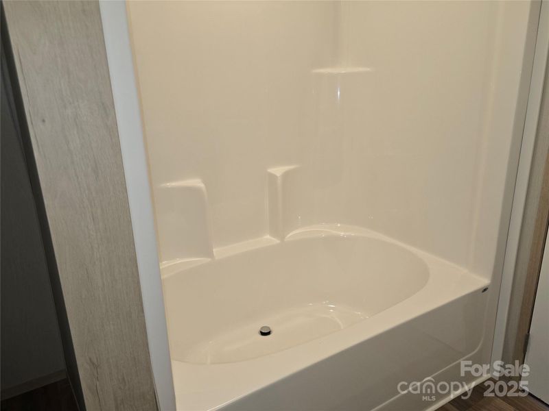 Large soaker tub in primary bathroom. Large soaker tub in primary bathroom.