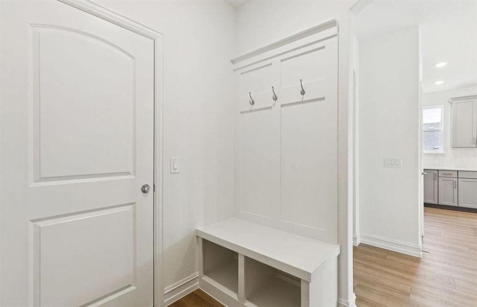 Mud bench at entry from garage Mud bench at entry from garage