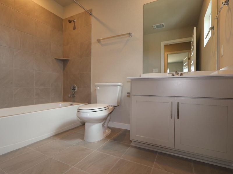 Furnished interior view inside a new home in Heritage, Dripping Springs (Image 6).