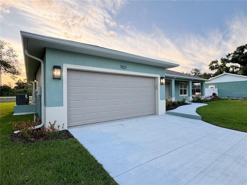 Front exterior of a new home in , Englewood, FL, highlighting curb appeal (Image 16).