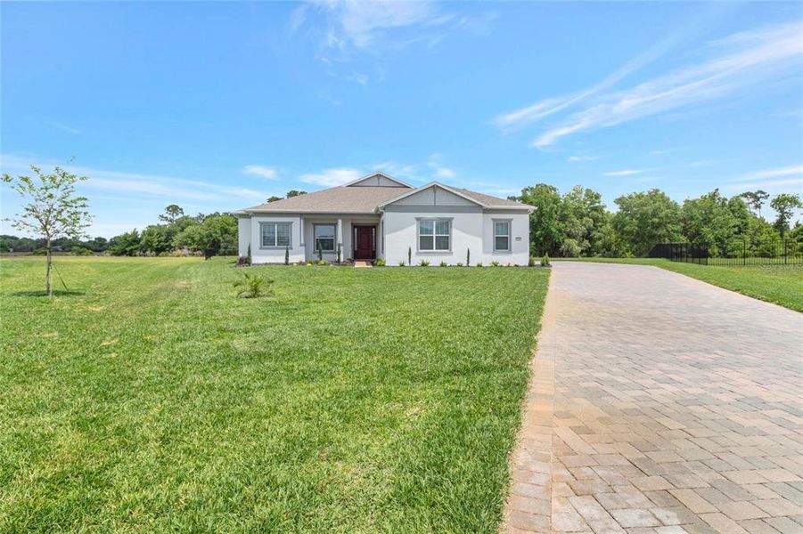Front exterior of a new home in , Orlando, FL, highlighting curb appeal (Image 32).