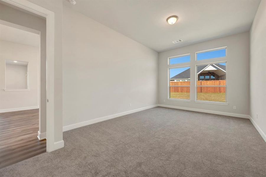 Spare room with light carpet