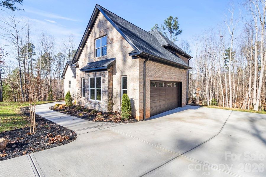 Front exterior of a new home in , Lincolnton, NC, highlighting curb appeal (Image 23).