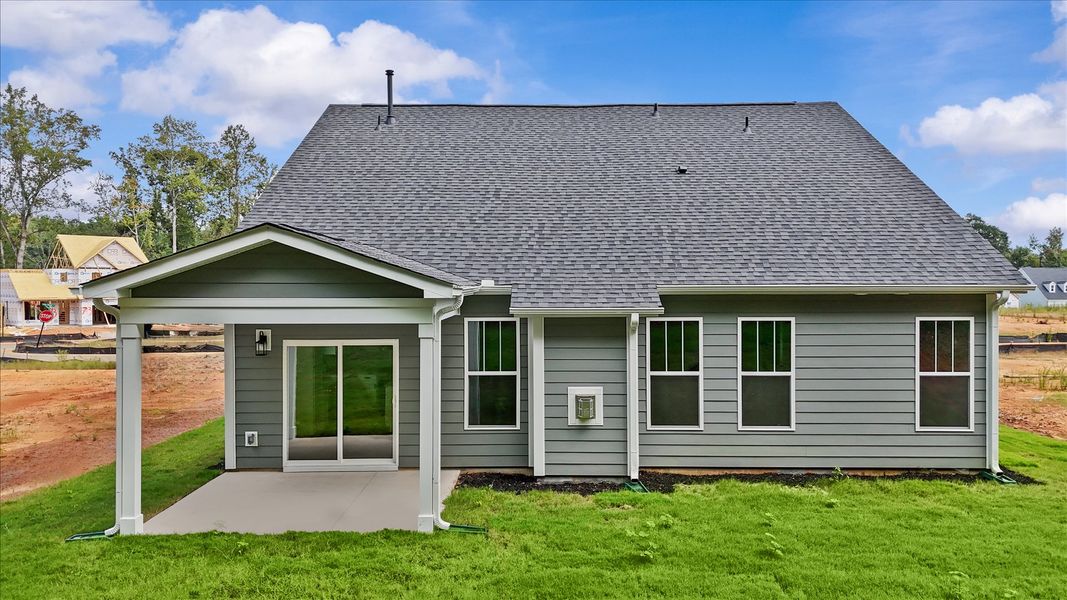 Accomplished exterior with a spacious rear porch that blends comfort and style