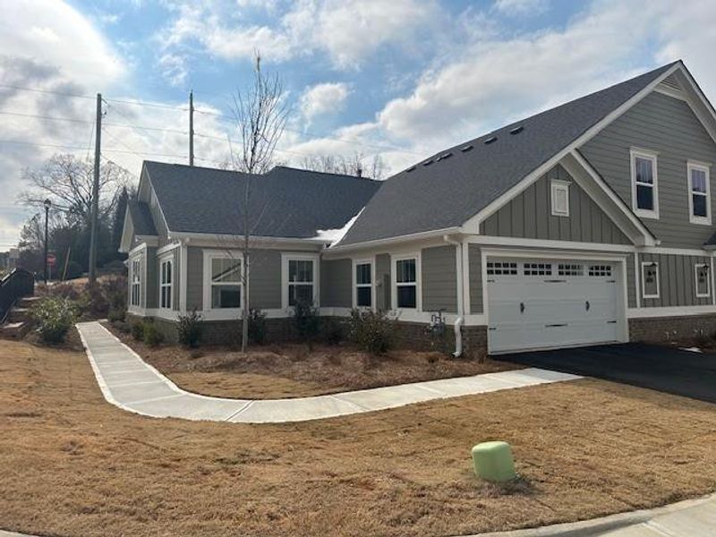 Front exterior of a new home in , Cumming, GA, highlighting curb appeal (Image 15).