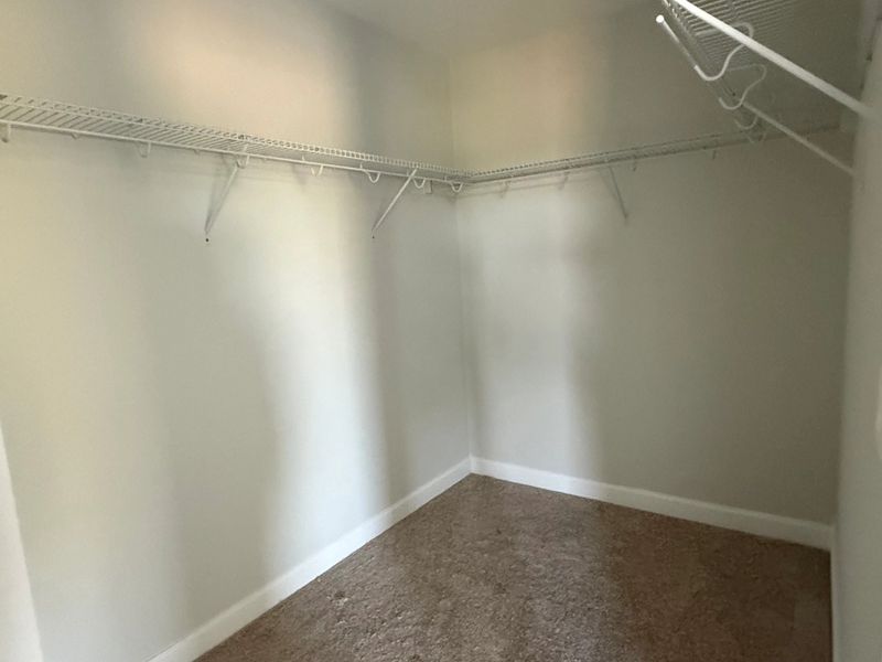 Spacious primary walk-in closet