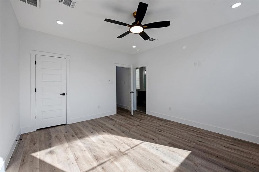 Another view of the large primary bedroom. All bedrooms feature a ceiling fan to help keep the home cool during the summer.