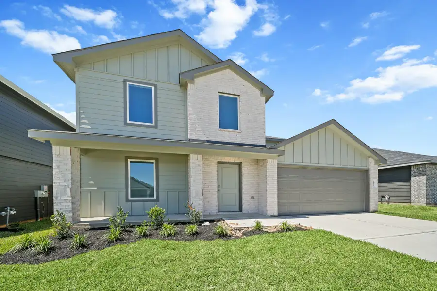 Front exterior of a new home in Mill Creek, Magnolia, TX, highlighting curb appeal (Image 1). Front exterior of a new home in Mill Creek, Magnolia, TX, highlighting curb appeal (Image 1).