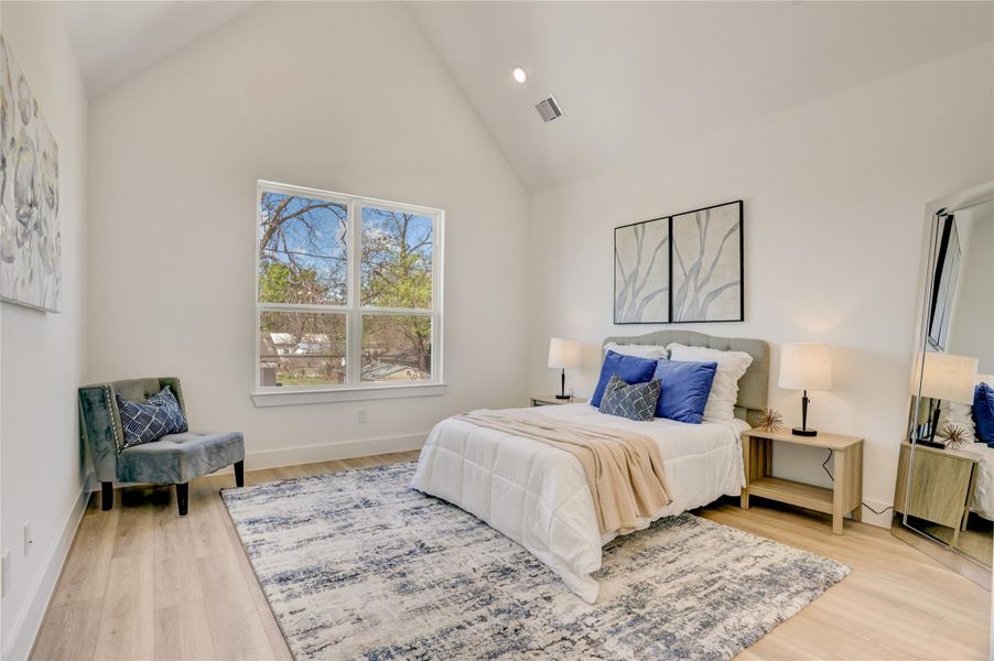The 13x14 SF primary bedroom has a cathedral ceiling.