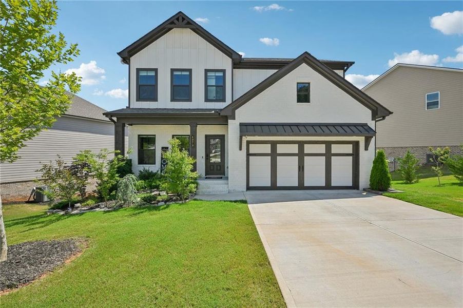 Front exterior of a new home in , Auburn, GA, highlighting curb appeal (Image 2).