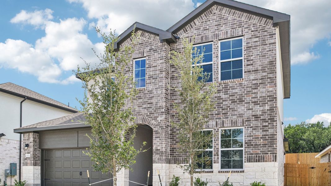 Front exterior of a new home in Rosenbusch Ranch, Leander, TX, highlighting curb appeal (Image 17).