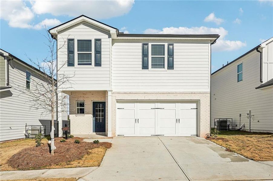Front exterior of a new home in Hawthorne Station, College Park, GA, highlighting curb appeal (Image 1). Front exterior of a new home in Hawthorne Station, College Park, GA, highlighting curb appeal (Image 1).