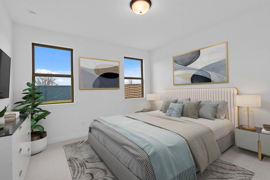 Spacious primary bedroom with natural light, private en suite, and a tranquil setting at the rear of the home.