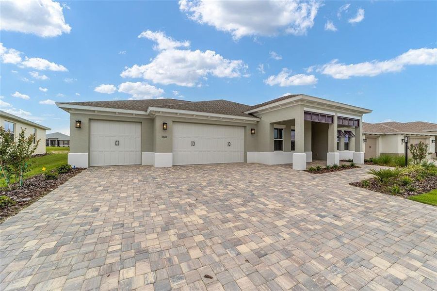 Front exterior of a new home in On Top of the World Communities, Ocala, FL, highlighting curb appeal (Image 20).