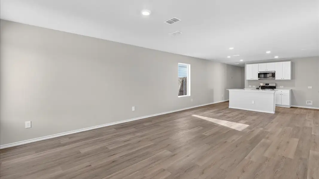 Representative unfurnished interior of a home built from the Barton by D.R. Horton in Hickory Grove, Krum (Image 9).